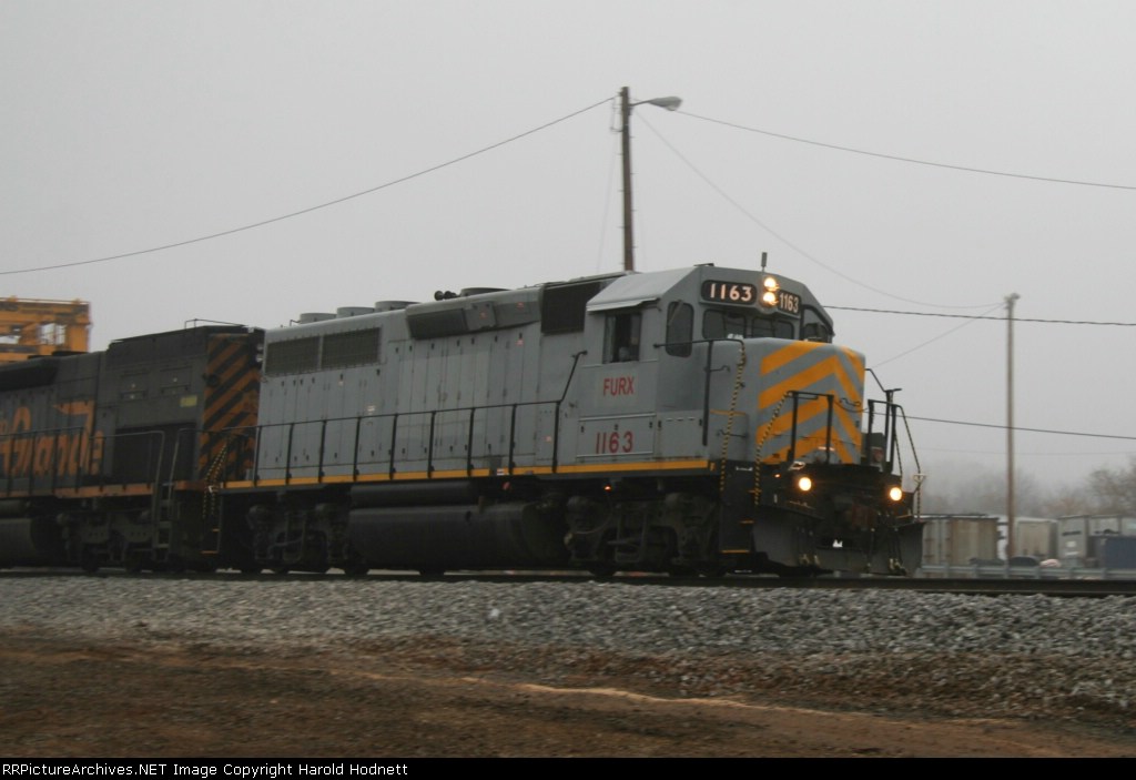 FURX 1163 leads a southbound train on a foggy morning